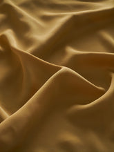 The brown cloth is made from viscose fabric.
